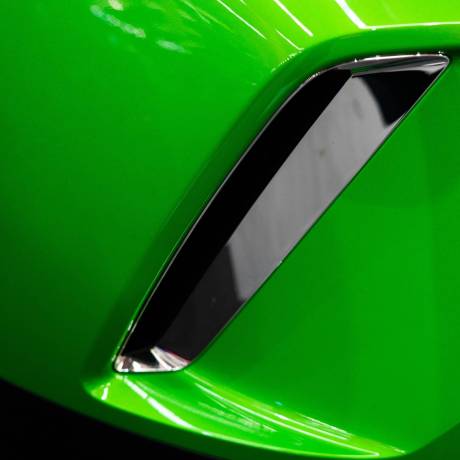 detail-of-a-modern-exhaust-on-a-green-car-2023-11-27-05-17-19-utc-min-min